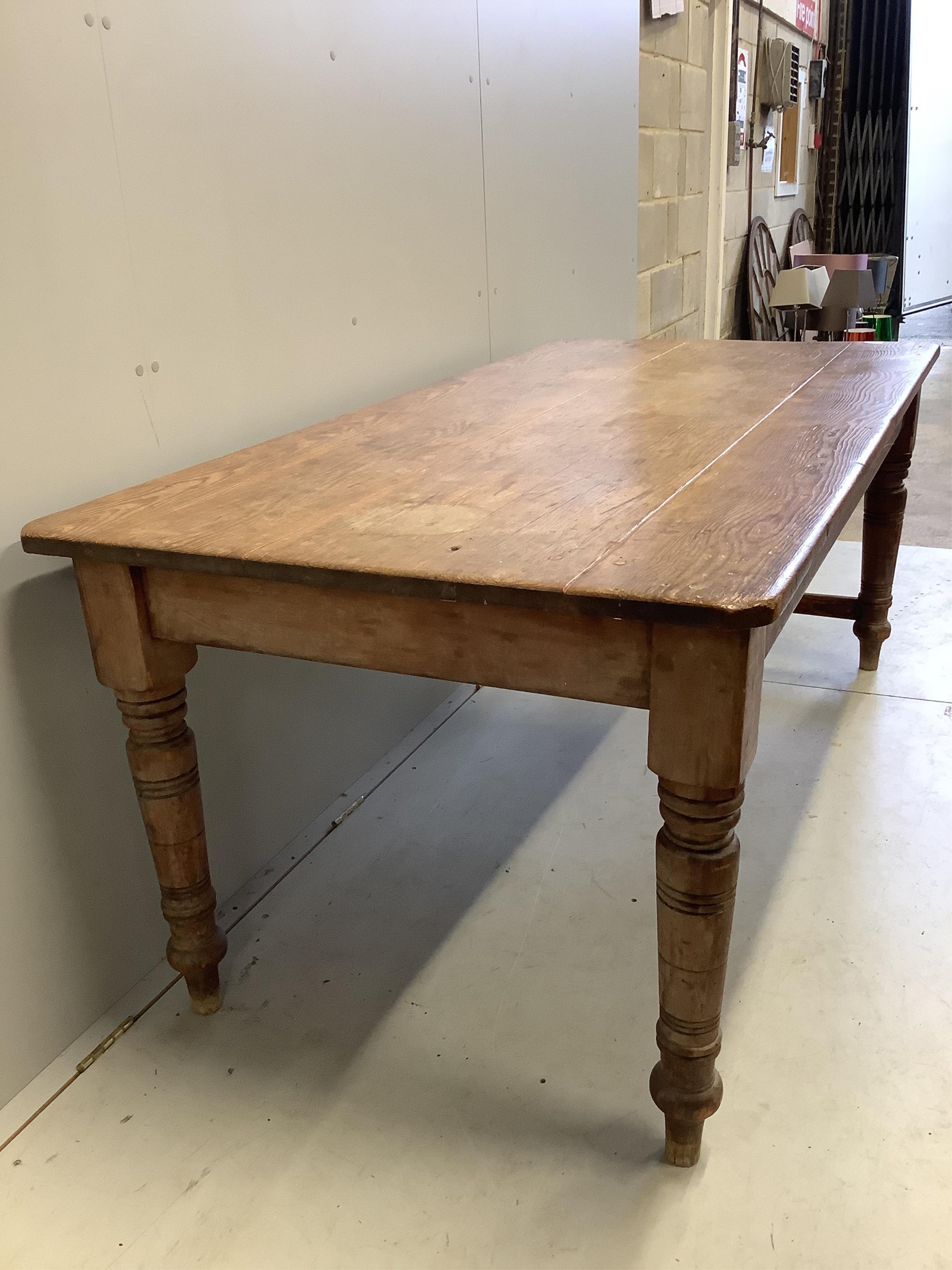 A Victorian rectangular pitch pine kitchen table, width 183cm, depth 90cm, height 75cm. Condition - fair